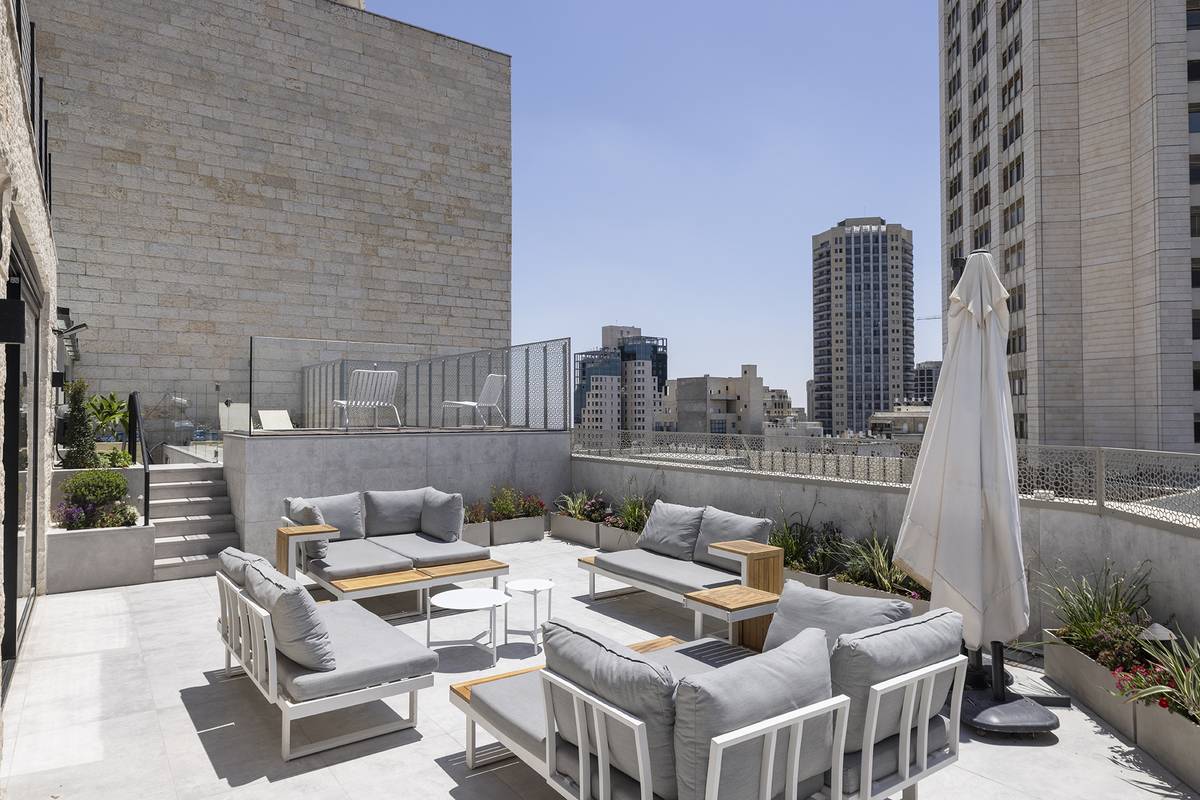 Heated rooftop pool and outdoor dining terrace at Aura Penthouse Jerusalem – photo 12