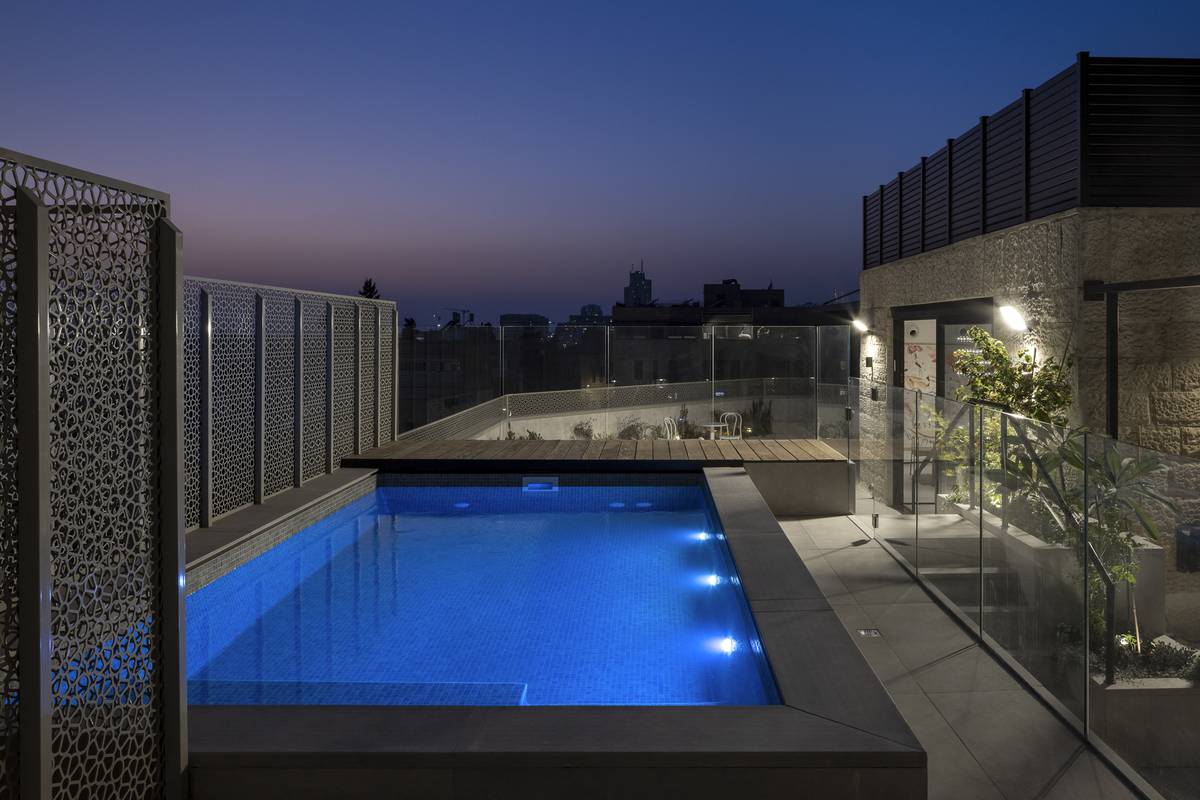 Heated rooftop pool and outdoor dining terrace at Aura Penthouse Jerusalem – photo 3