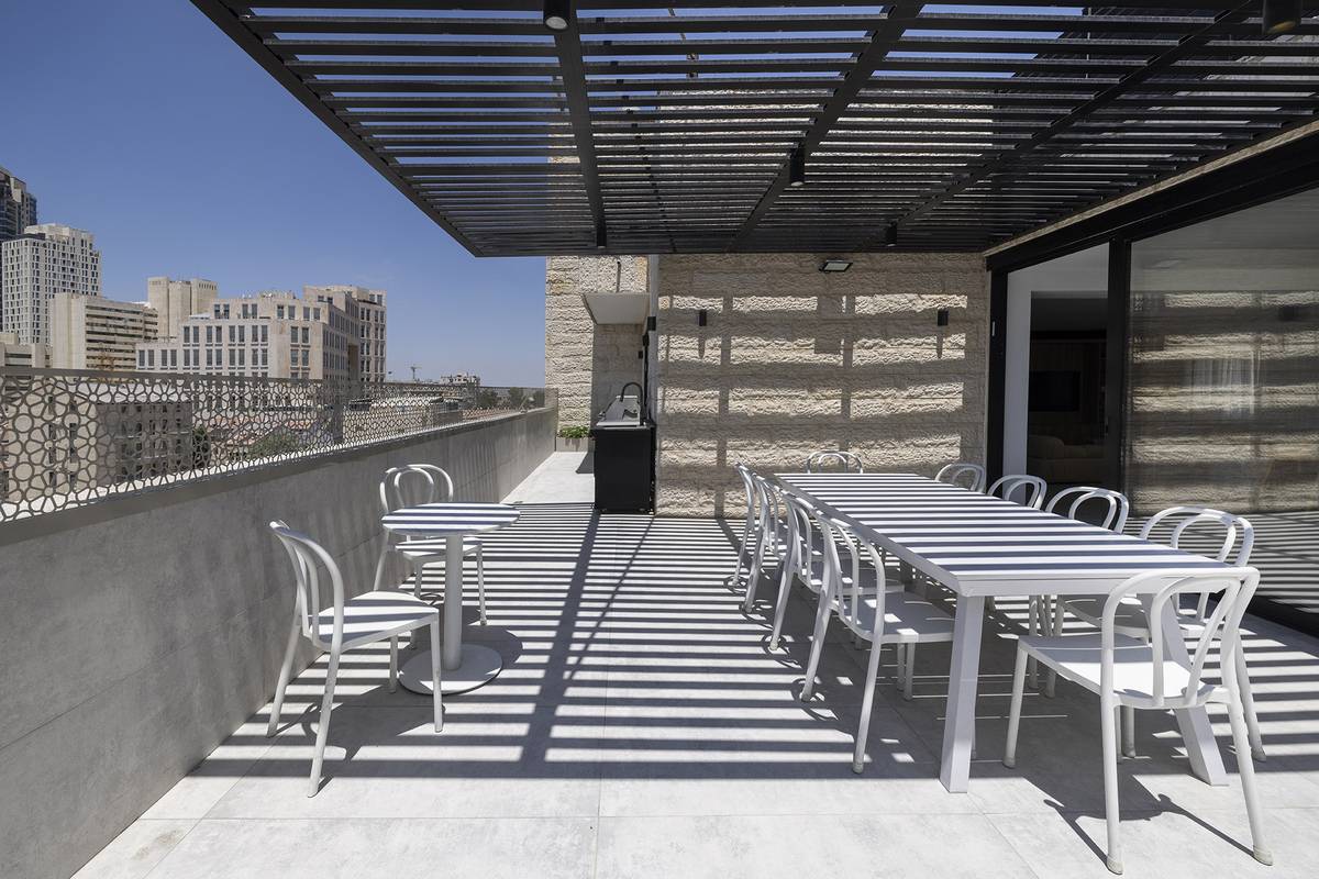 Heated rooftop pool and outdoor dining terrace at Aura Penthouse Jerusalem – photo 6